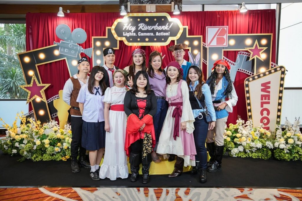 Group of colleagues posing in movie costumes at the photo booth for Riverbank Annual Dinner 2026.